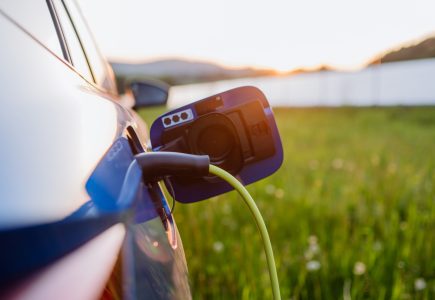 Close up of electric car charging, concept of ecology and sustainability. Close up of an electric car charging, concept of ecology and sustainability.